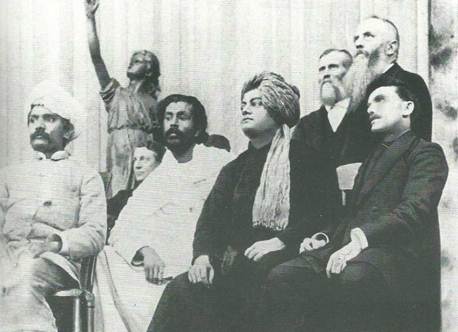 A picture of Swami Vivekananda sitting on stage at the Parliament of Religions in Chicago, in 1893.
